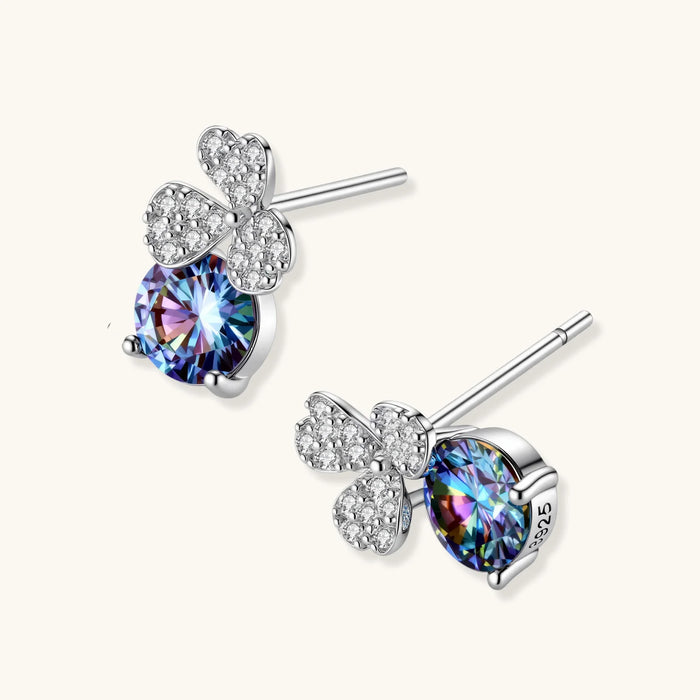 Sterling silver stud earrings with four-leaf clover design featuring small crystals above round moissanite stones