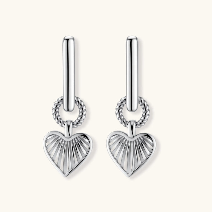 Platinum-plated 925 sterling silver rectangular hoop earrings with twisted ring connector and ribbed heart charm pendant.