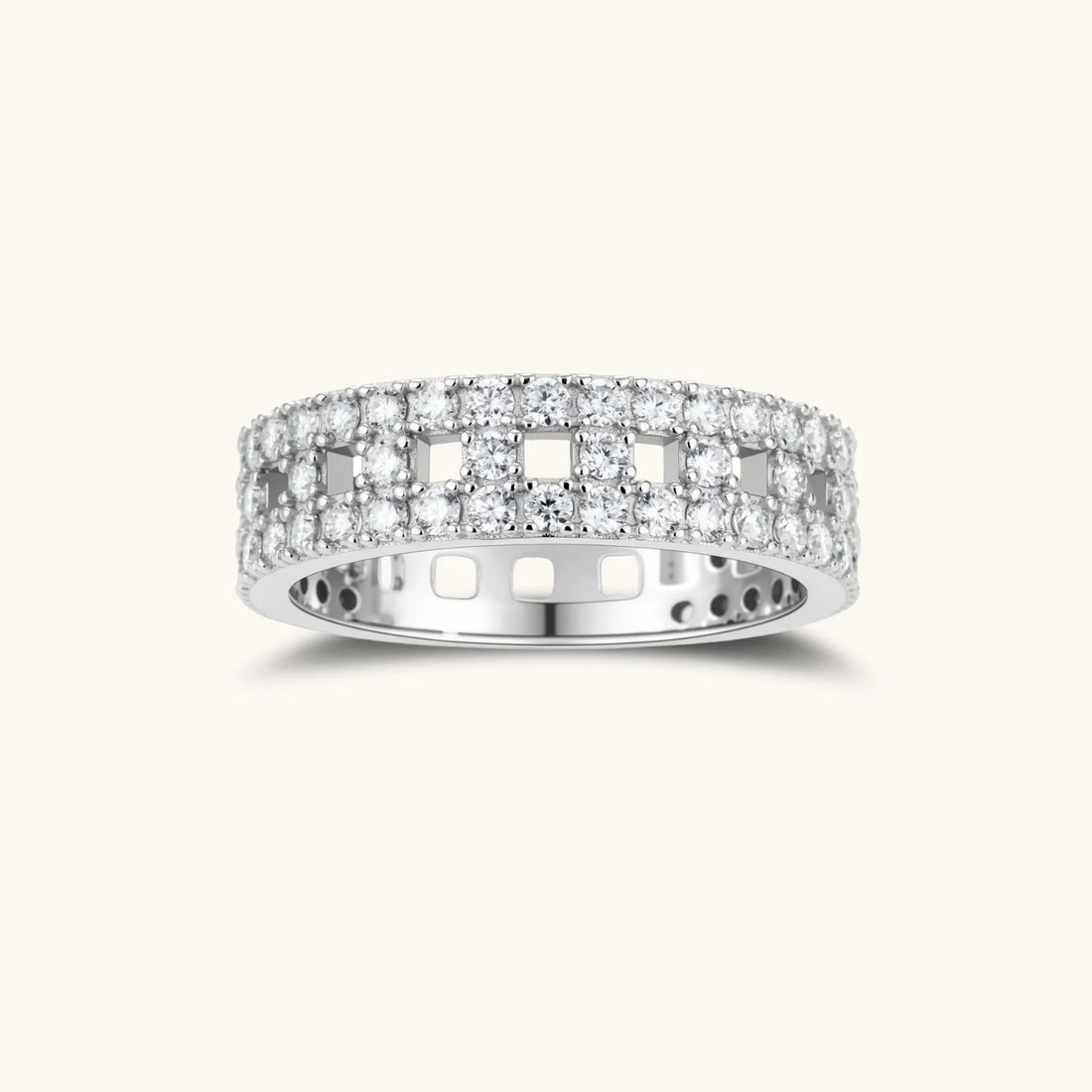 Wide sterling silver ring with three rows of brilliant moissanite stones in geometric pavé setting on white background