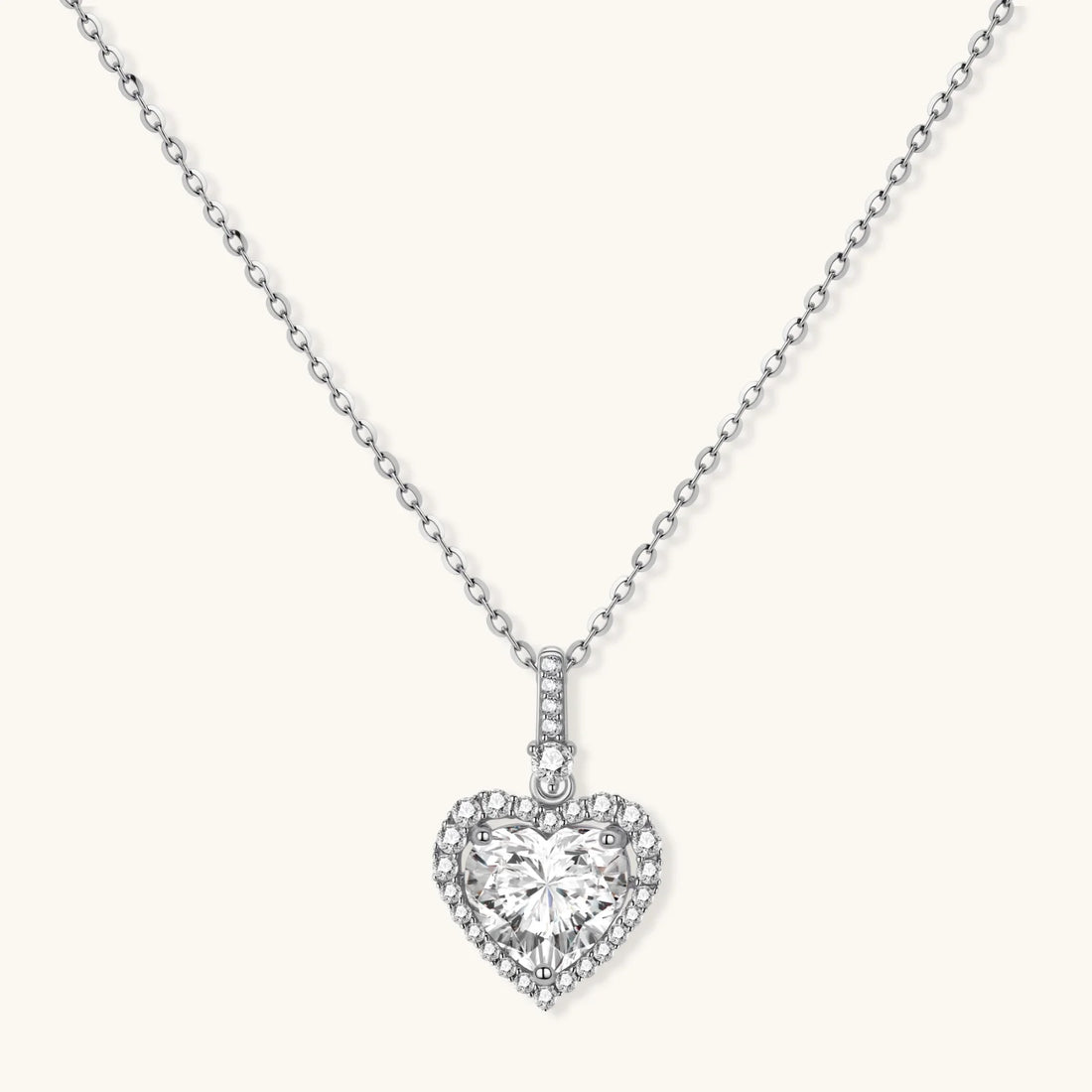 Sterling silver heart pendant necklace with brilliant moissanite center stone and halo setting on delicate chain