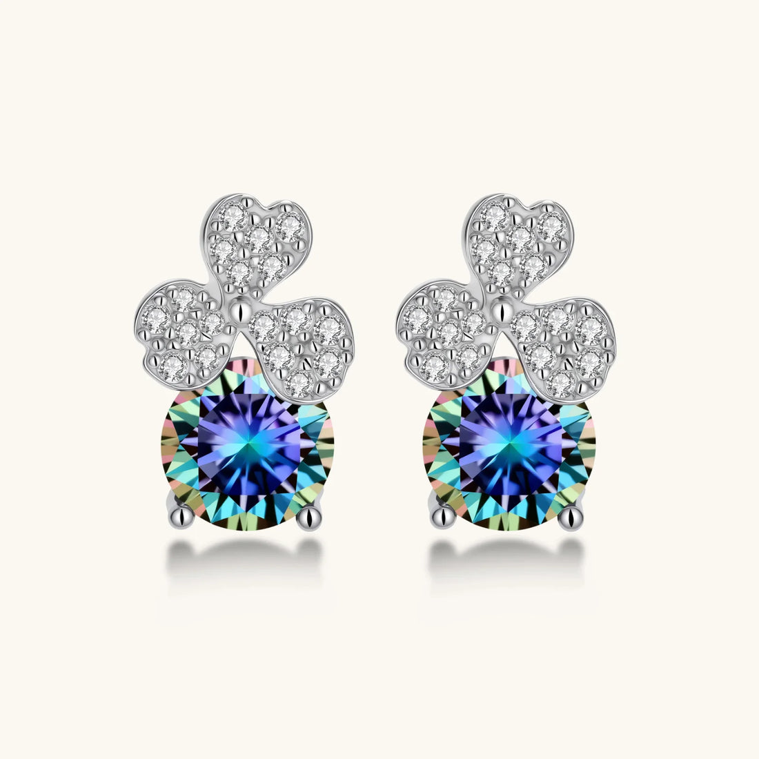 Sterling silver stud earrings with four-leaf clover design featuring small crystals above round moissanite stones